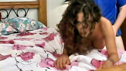 White guy doggy style fucking curly haired ebony girl on bed