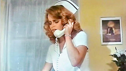 Vintage redhead nurse in tight white uniform on phone call