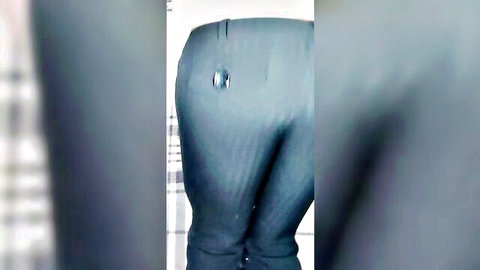 Curvy woman's big ass in tight low-rise blue pants with large button