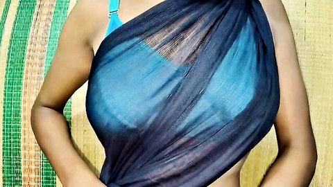 Indian woman teasing big tits in sheer black saree over blue bra