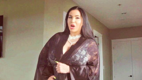 Busty Korina Kova in open black lace robe, seductive cleavage pose