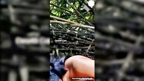 South Asian woman outdoors pants down exposing bare ass and pussy from behind in doggy pose