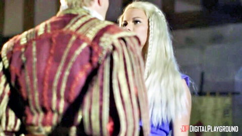 Peta Jensen in blue fantasy dress gazing at partner in ornate jacket