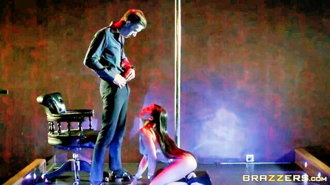Madison Ivy as busty MILF stripper kneeling seductively near pole