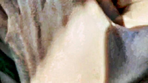 Blurry close-up of Asian woman's exposed genitals and legs spread wide