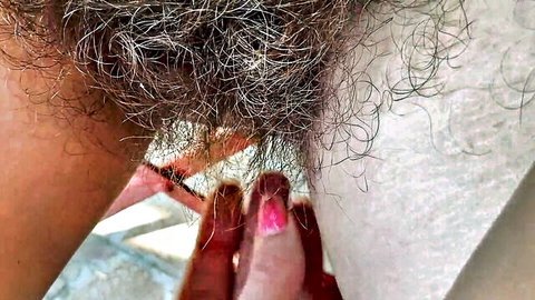 Mature hairy bush fetish close-up with fingers spreading labia