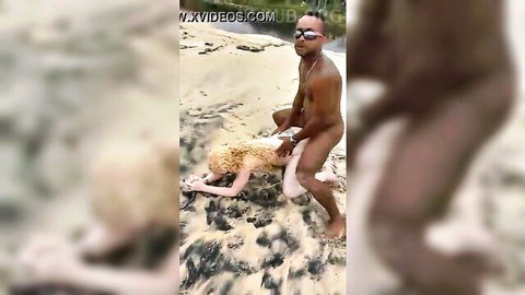 Interracial beach sex: black stud in doggy with blonde woman