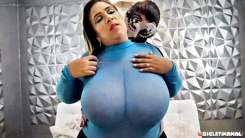 Chela Renteria huge tits in sheer blue top, embraced by masked man