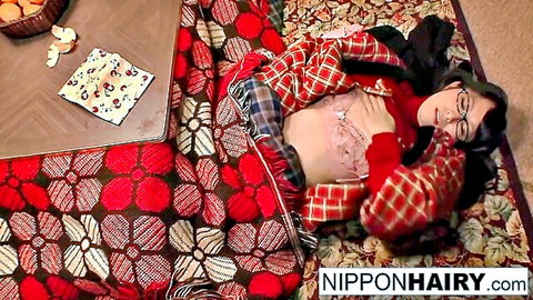 Hairy Japanese woman in glasses lies topless after reading sexy book