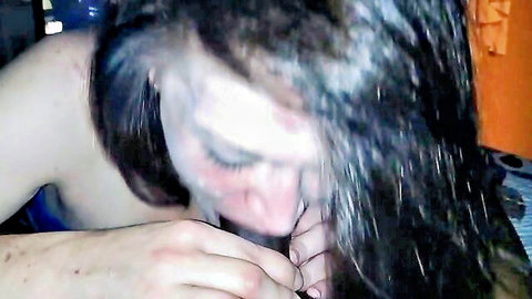 Brunette woman deepthroats thick cock balls-deep with messy face and gripping hands in rough blowjob