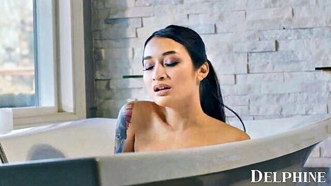Petite Asian Avery Black nude in steamy bathtub, sensual gaze