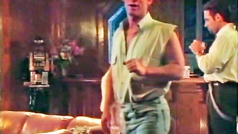 Vintage 1994 threesome scene with two men and lounging woman in green top