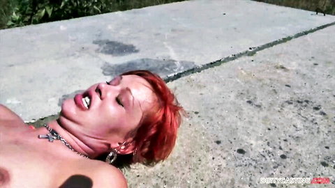 Redhead MILF Lucia nude on highway in amateur outdoor sex