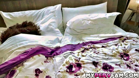 Clara lying in bed with curly hair, awaiting stepdad Scott Trainor
