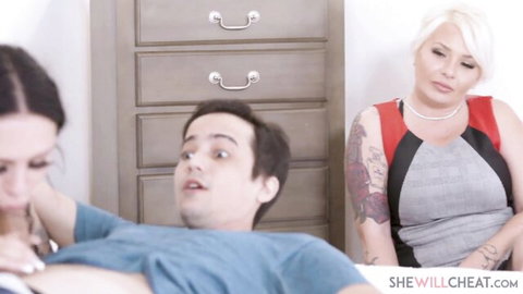 Pale tattooed Mia Moore watches brunette give blowjob in threesome