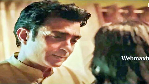 Indian couple in kurta gazing passionately at each other in intimate moment