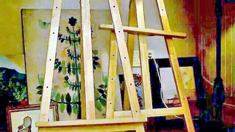 Art studio scene with multiple wooden easels displaying plant paintings on yellow wall.