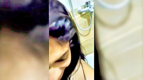 Blurry closeup of sexy Indian babe with wet purple hair in steamy shower teasing