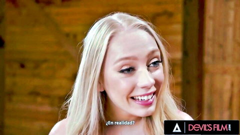 Slimthick Vic busty blonde smiling in cleavage-revealing top