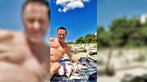 Gigi and Dave nudist beach sex show, older man in purple briefs on sand