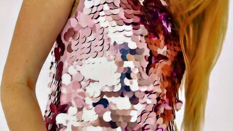 Blonde model teasing in sparkly pink sequin top during striptease