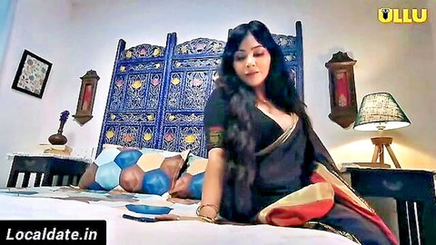 Unsatisfied Indian model in black saree showing cleavage