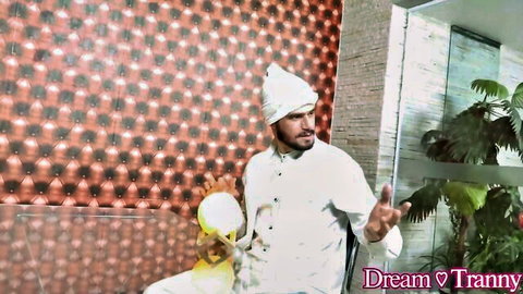 Sexy trans tranny chef in white uniform holding yellow bowl seductive kitchen pose