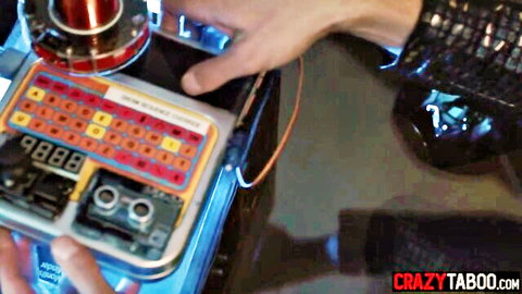 Alex Coal in sci-fi gadget scene, hands on mysterious device