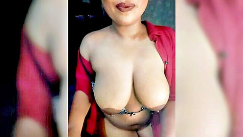 Curvy Indian MILF exposes massive bare tits and dark nipples through open red blouse