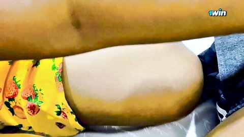 Sri Lankan chunky MILF exposing thick thighs in yellow floral dress