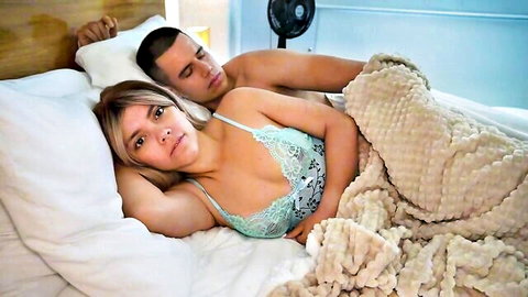 Blonde stepmom in green lace lingerie cuddles shirtless stepson in bed