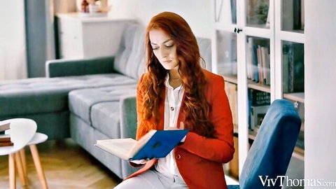 Katy Rose in red blazer reading book sensually, teasing lesbian heat