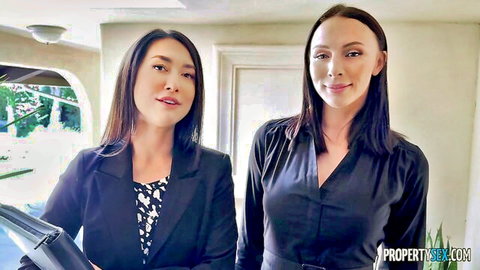 Two sexy Asian real estate agents in blazers smiling for Selling Houses Can Be Fun by Property Sex