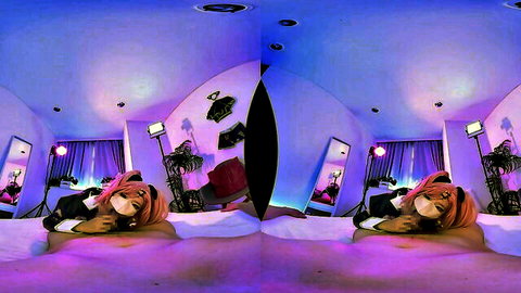 Naughty pink-haired catgirl cosplayer lounging seductively on bed in purple VR room
