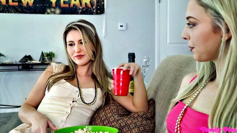 Lily Larimar and Paige Owens teasing playfully in party tops and necklaces