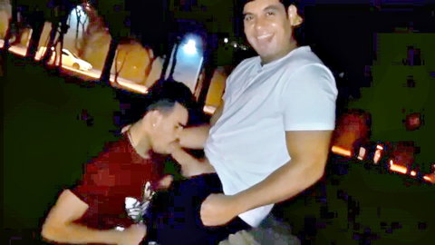 Two Latin men in outdoor blowjob scene at night, public oral sex