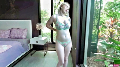 Tattooed blonde babe in sheer mint lingerie teasing with big tits and toned body in bedroom