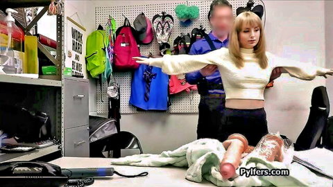 Blonde in sweater frisked by guard near cum-covered big dildo in office