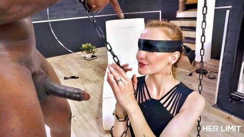 Blindfolded redhead Belle Claire in chains strokes massive black cock