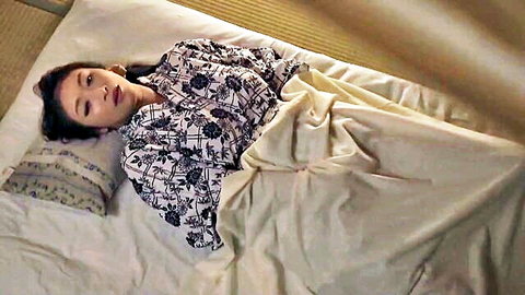 Reiko Kobayakawa in floral kimono lying seductively on bed, mature Japanese beauty
