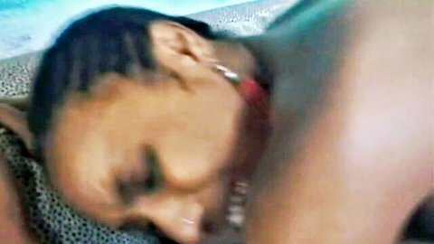 Ecstatic ebony babe with braids moans in pleasure as black man's arm grips her neck intimately