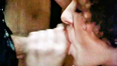 Vintage 1980s close-up of dominant hand gripping woman's open mouth in Den of Dominance