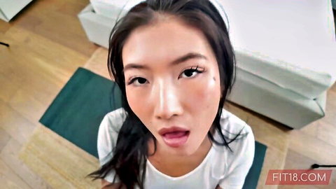 POV closeup of fit Chinese teen e-girl opening mouth wide teasing on yoga mat