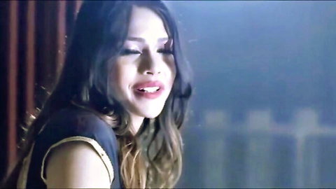 Seductive Indian MILF with tongue out and glossy lips teases cock sucking at party