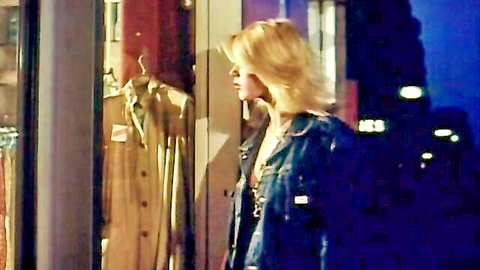Vintage 1980s blonde teen in denim jacket at night store window