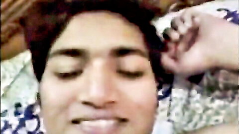 Cute Desi girl with eyes closed in pleasure during titty fuck with boyfriend