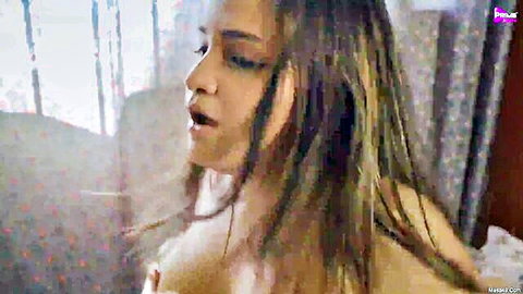 Hot Indian babe with massive bare tits moans in ecstasy topless closeup