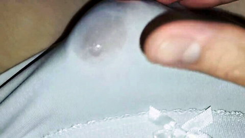 Close-up of wet white panties teased by finger in amateur solo