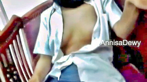Indonesian ABG teen exposes perky breasts in unbuttoned white shirt