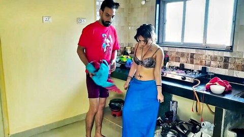 Sexy Indian housewife in black lacy bra and blue skirt teasing man in kitchen